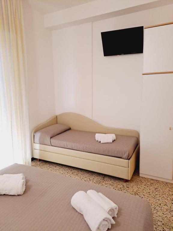 Postel nebo postele na pokoji v ubytování Hotel Helvetia