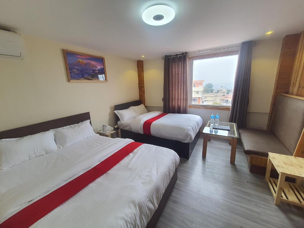 Postel nebo postele na pokoji v ubytování Hotel Odaan