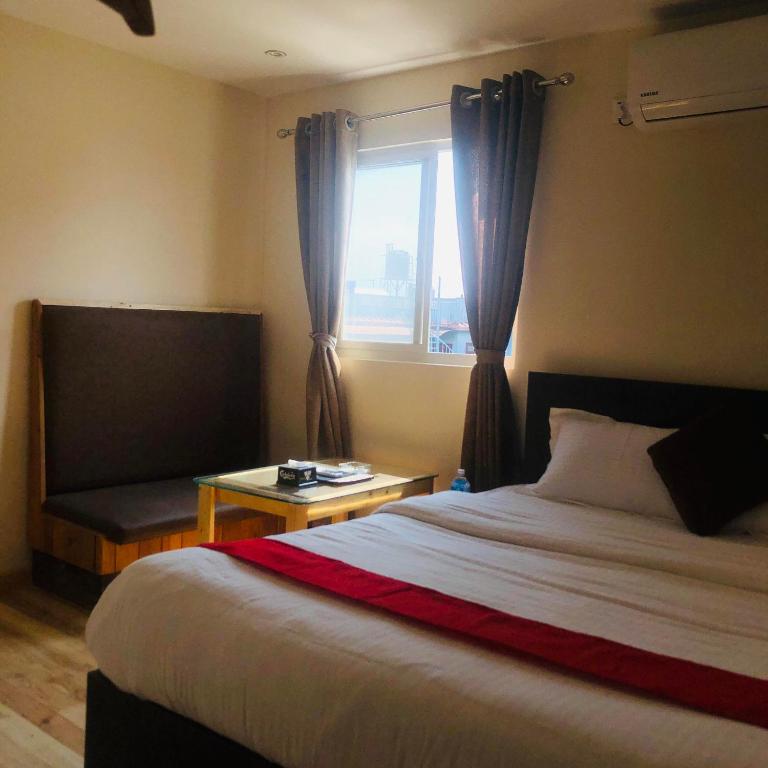 Postel nebo postele na pokoji v ubytování Hotel Odaan