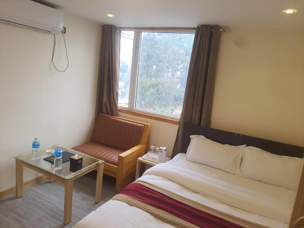 Postel nebo postele na pokoji v ubytování Hotel Odaan