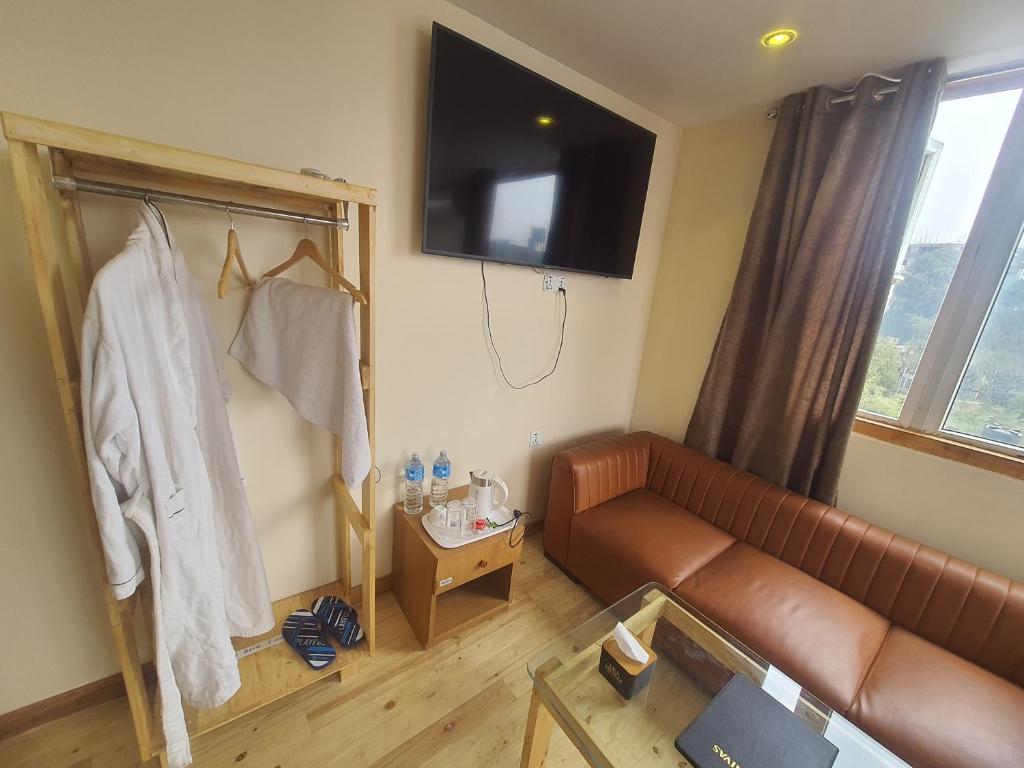 TV a/nebo společenská místnost v ubytování Hotel Odaan