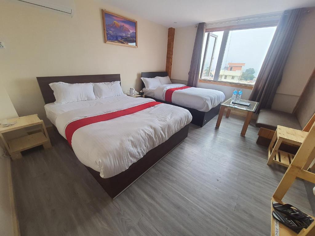 Postel nebo postele na pokoji v ubytování Hotel Odaan
