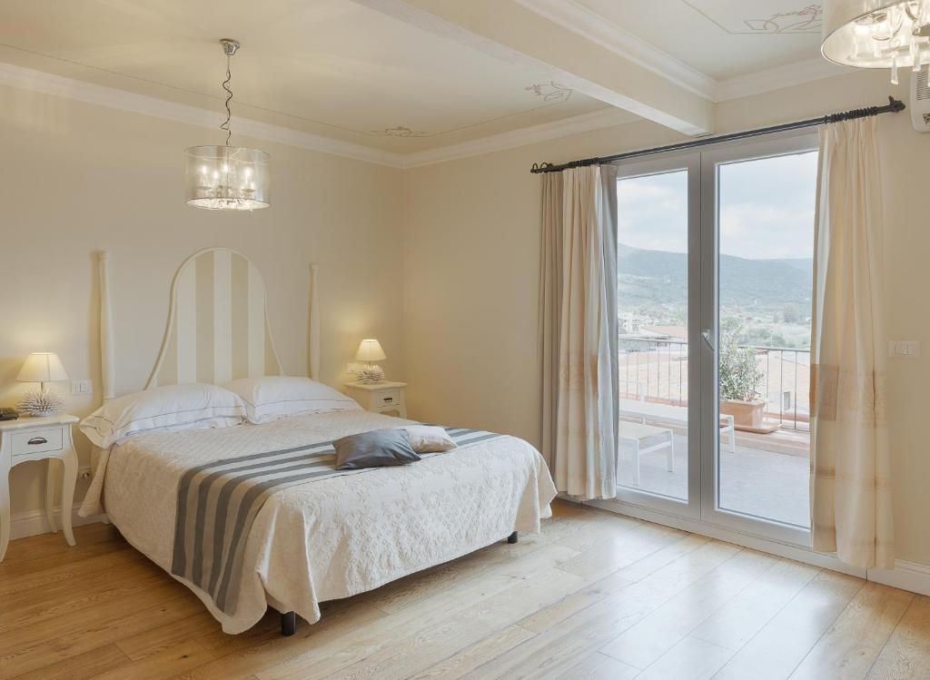 Giường trong phòng chung tại Palazzo Pischedda