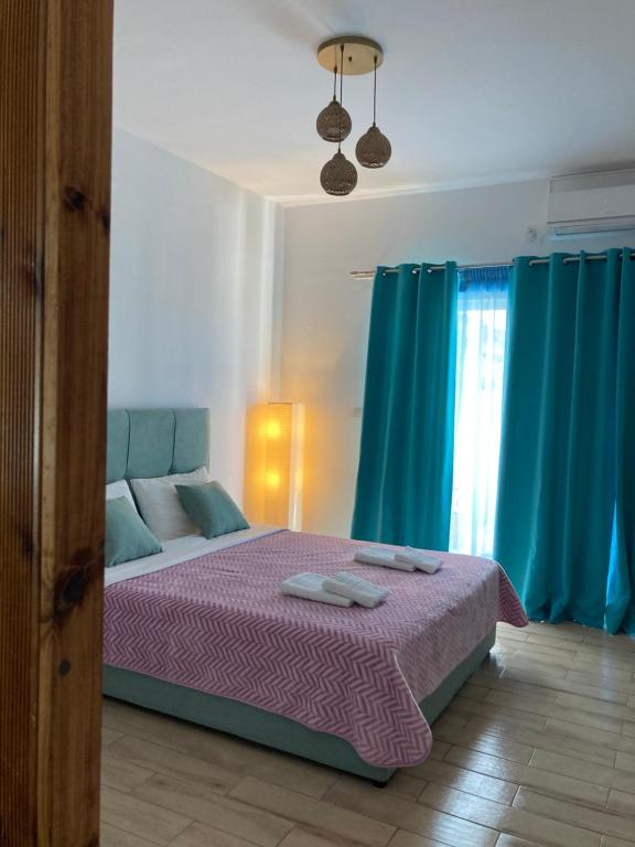 Postel nebo postele na pokoji v ubytování Soultana’s house