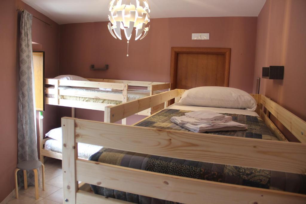 Postel nebo postele na pokoji v ubytování Casa Vacanze Sud e Magia