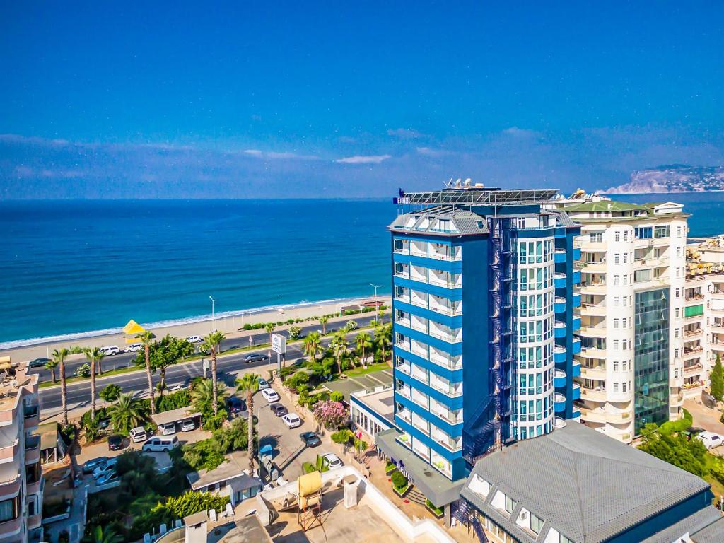 an aerial view of a building next to the ocean at Arsi Blue Beach Hotel in Alanya
