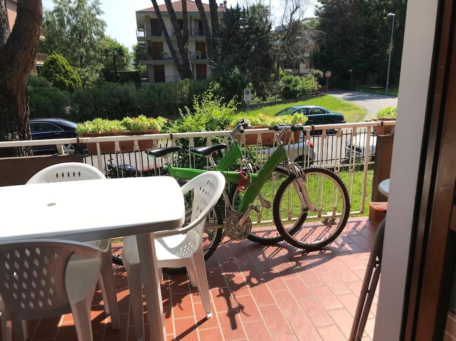 a bike parked on a patio with a table and chairs at La terrazza con le biciclette a due passi dal lago in Arona