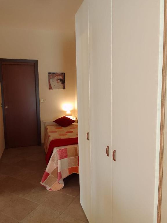 Łóżko lub łóżka w pokoju w obiekcie A casa di Iole