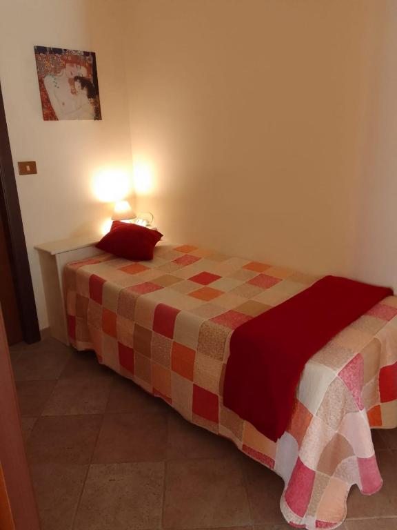 Łóżko lub łóżka w pokoju w obiekcie A casa di Iole