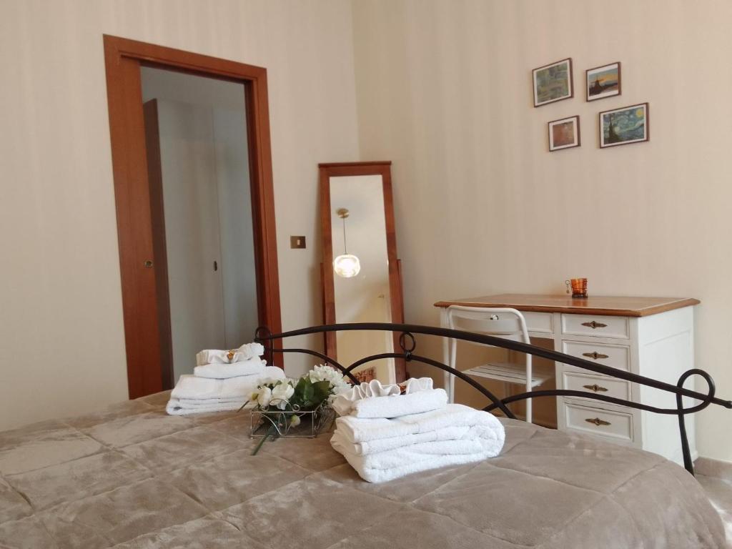Łóżko lub łóżka w pokoju w obiekcie A casa di Iole