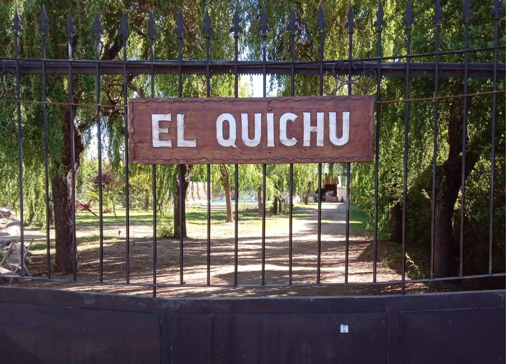 a gate with a sign that reads el quuthu at El Quichu in San Rafael