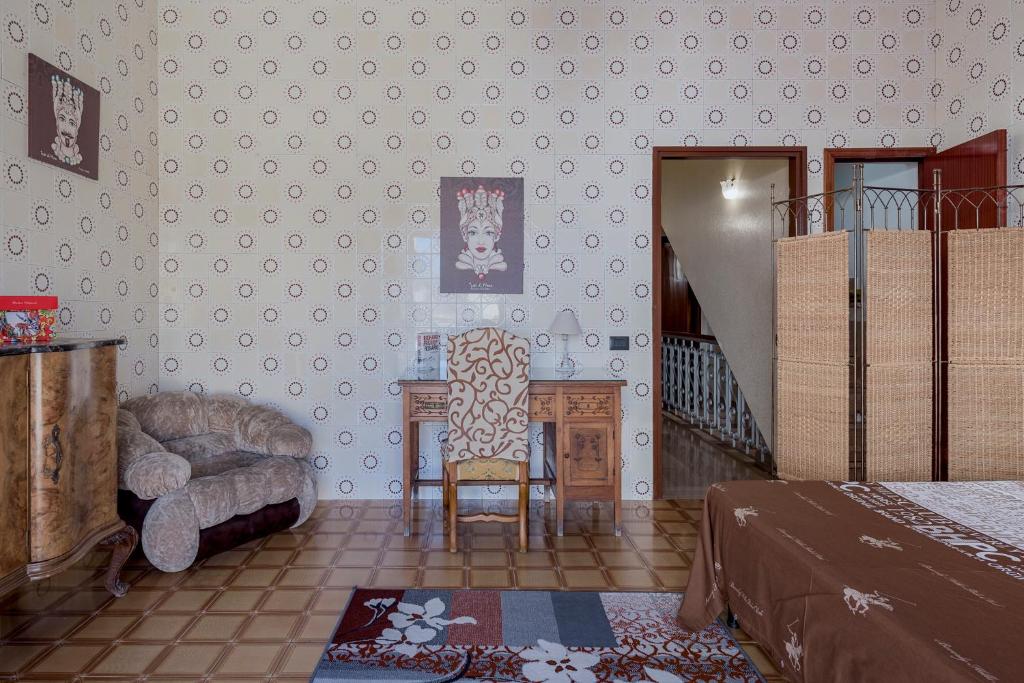 Łóżko lub łóżka w pokoju w obiekcie Casa Caterina