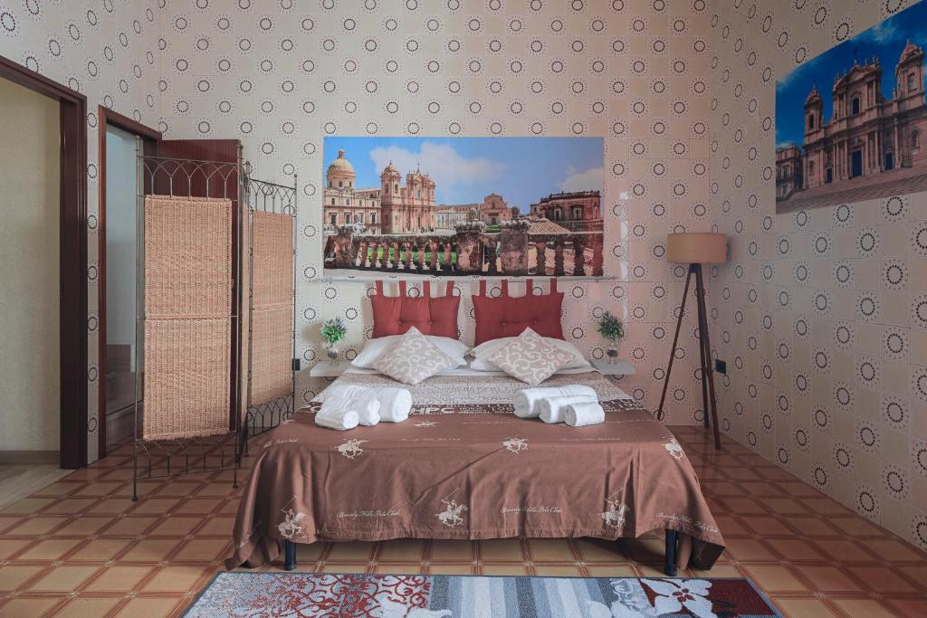 Łóżko lub łóżka w pokoju w obiekcie Casa Caterina