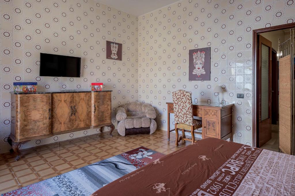 Łóżko lub łóżka w pokoju w obiekcie Casa Caterina