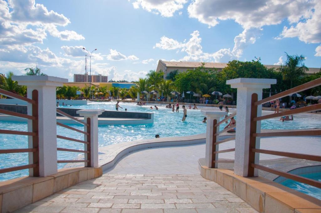 a pool at a resort with people in the water at Lacqua Diroma Loc Caldas in Caldas Novas