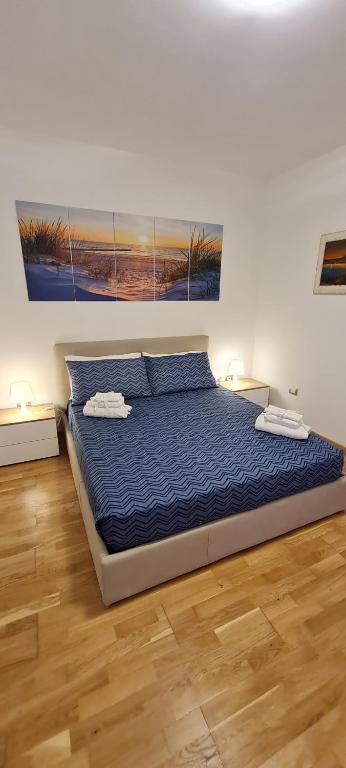 A bed or beds in a room at Gruppo Aedes Alghero, Residenza L'Isola - 200 mt dalla spiaggia