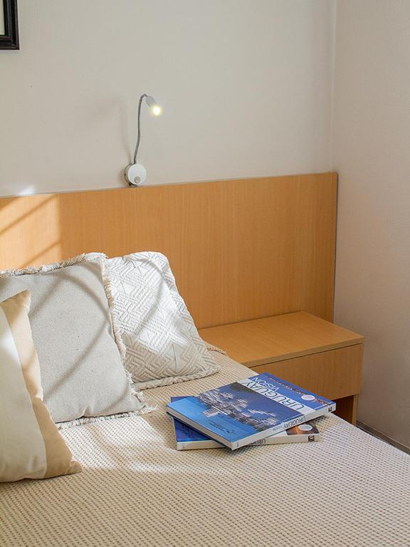 Postel nebo postele na pokoji v ubytování Hotel Ajax