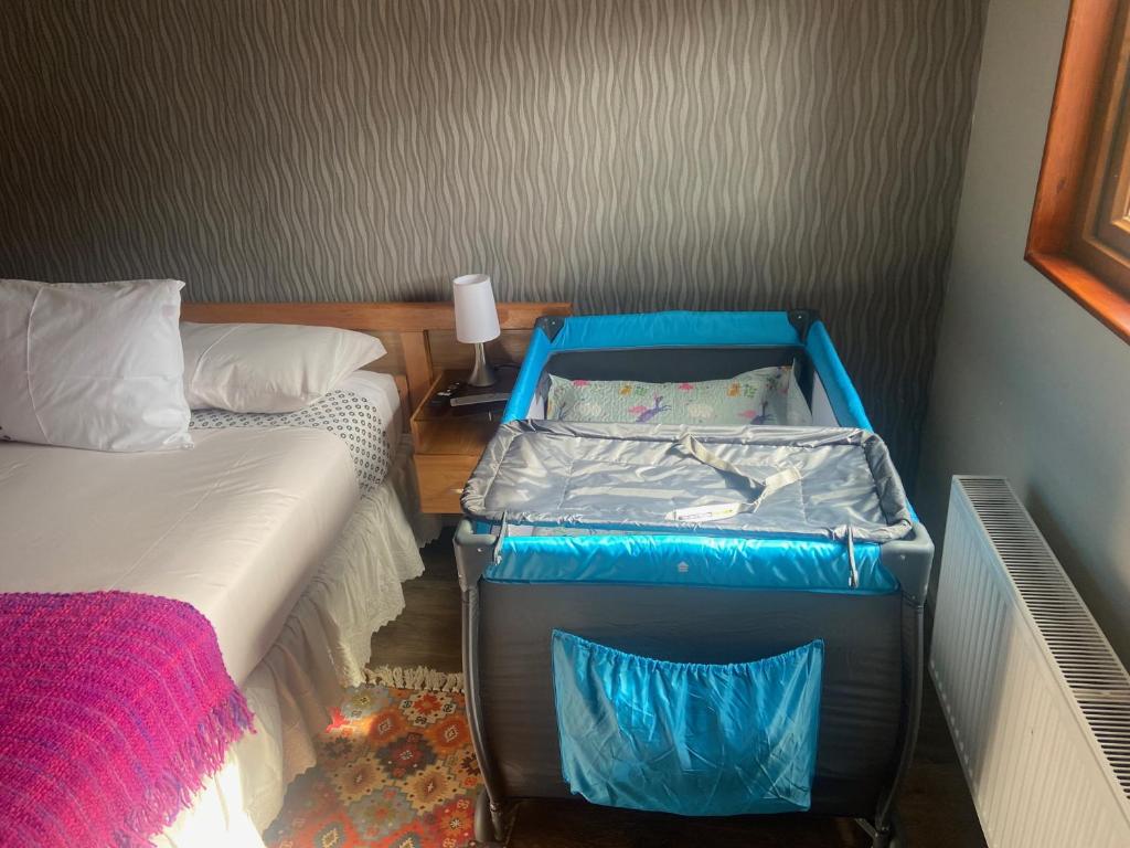 Uma cama ou camas num quarto em Cabañas Bosque Austral