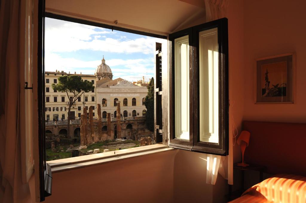 a window in a room with a view of a building at Temple View in Rome