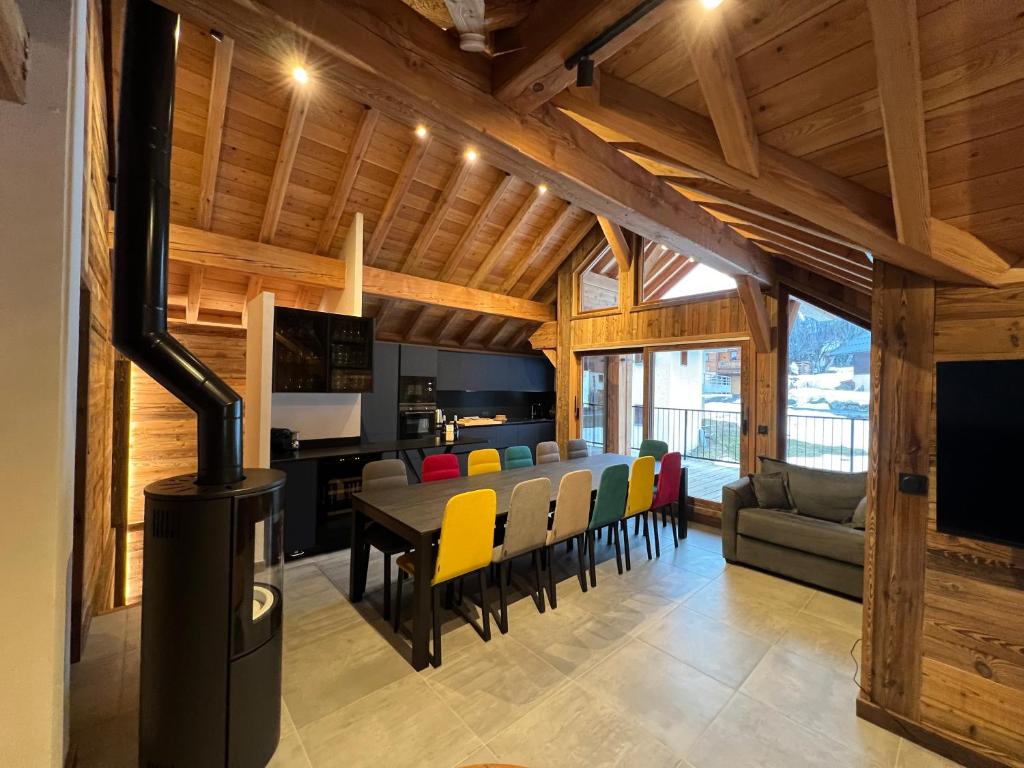 a kitchen and dining room with a table and chairs at Galibier & Spirit in Valloire