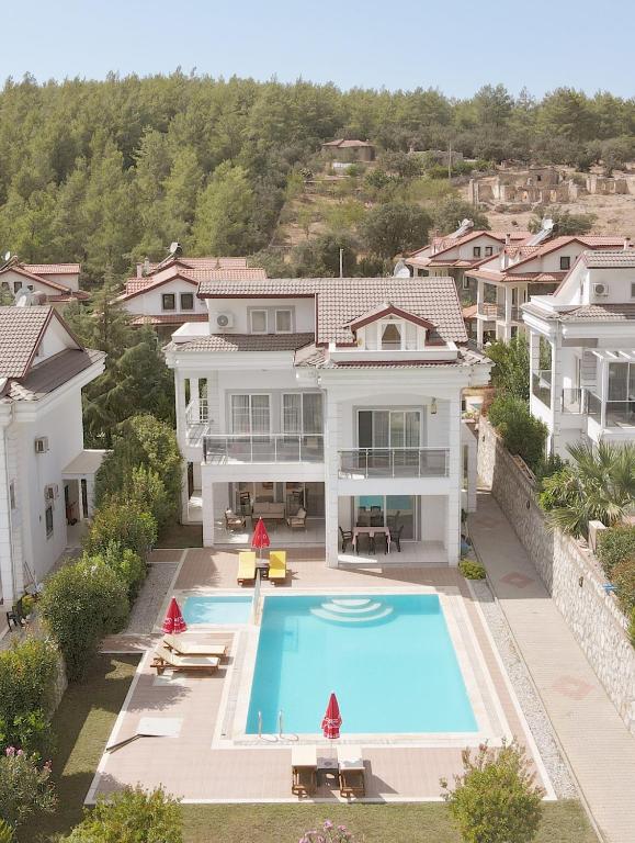 an aerial view of a house with a swimming pool at Villa Raya 1 in Fethiye