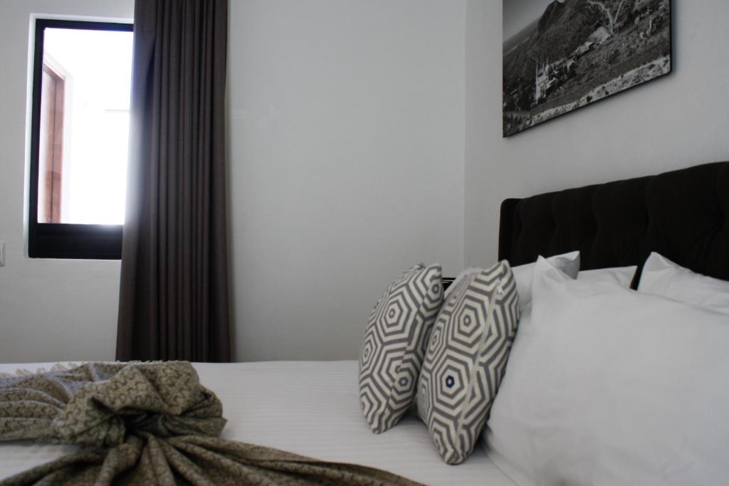 Postel nebo postele na pokoji v ubytování HOTEL MINA REAL