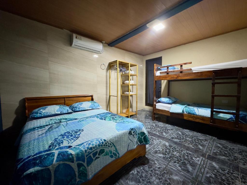 Postel nebo postele na pokoji v ubytování Casa Quepos