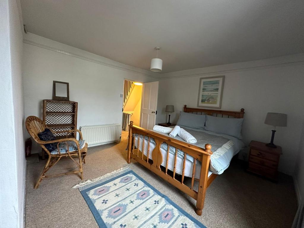 Postel nebo postele na pokoji v ubytování Nutshell Cottage