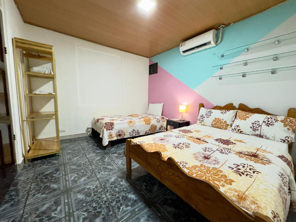 Postel nebo postele na pokoji v ubytování Casa Quepos