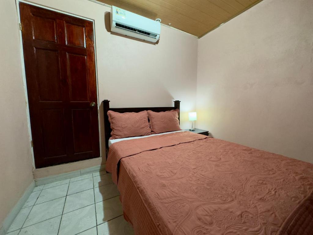 Postel nebo postele na pokoji v ubytování Casa Quepos