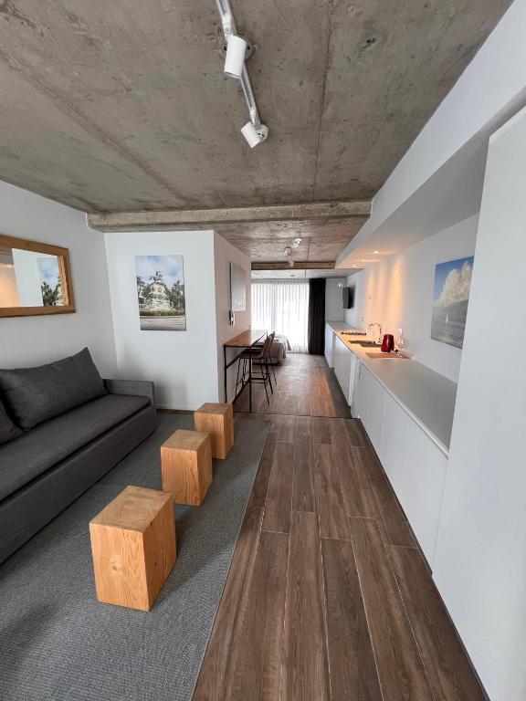 a living room with a couch and a table at Departamentos en Gral Paz a pasos de clínicas in Córdoba