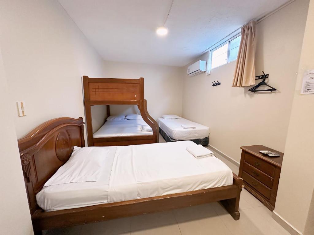Postel nebo postele na pokoji v ubytování Hostal Posada Del Sol