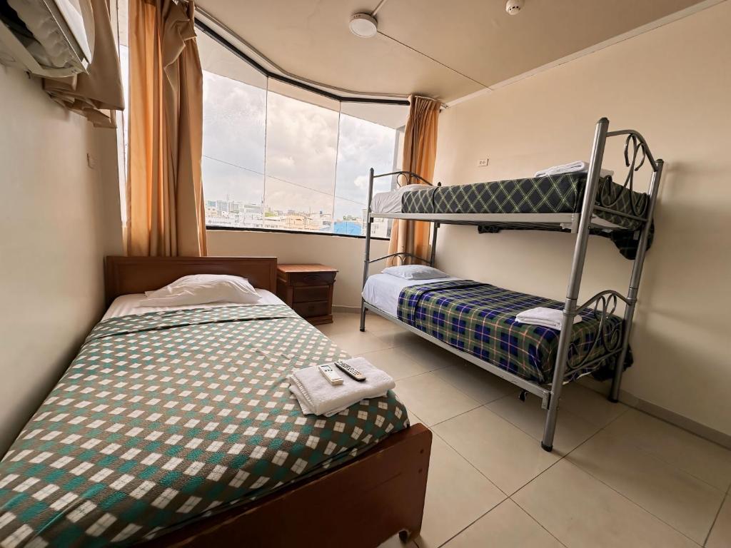 Postel nebo postele na pokoji v ubytování Hostal Posada Del Sol