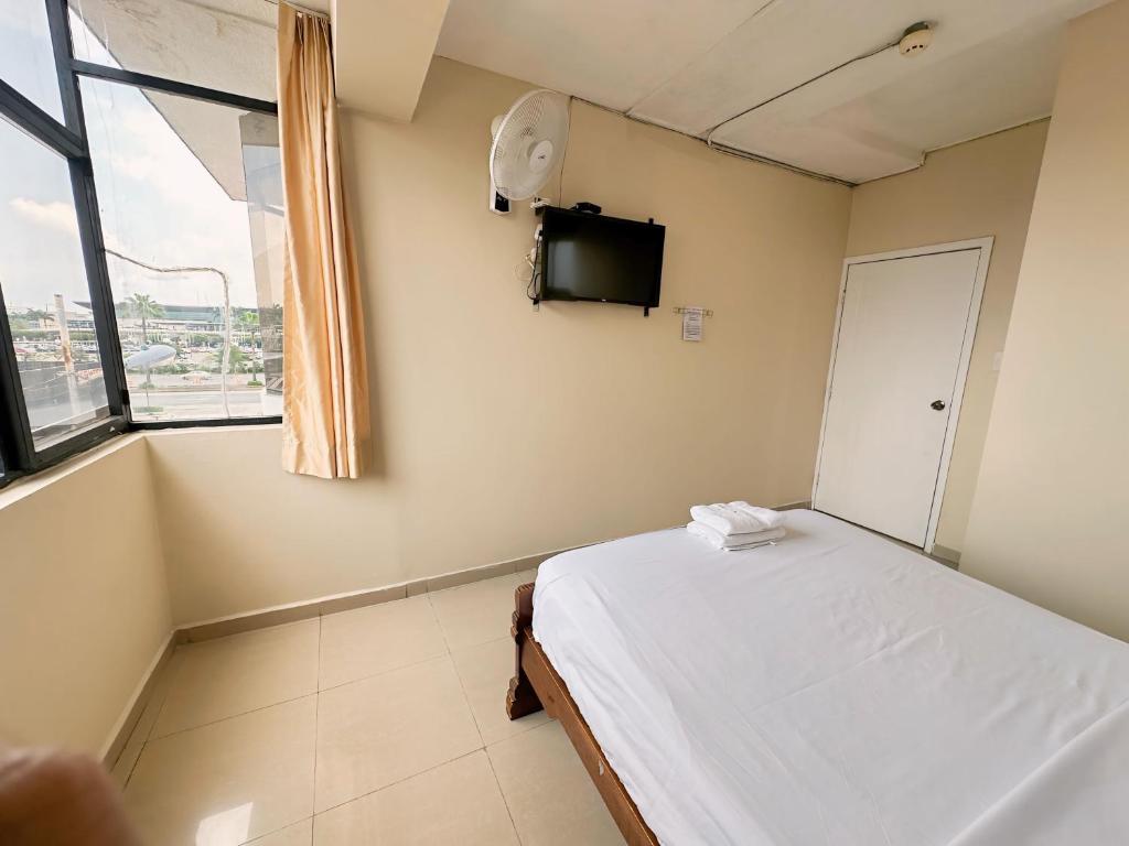 Postel nebo postele na pokoji v ubytování Hostal Posada Del Sol