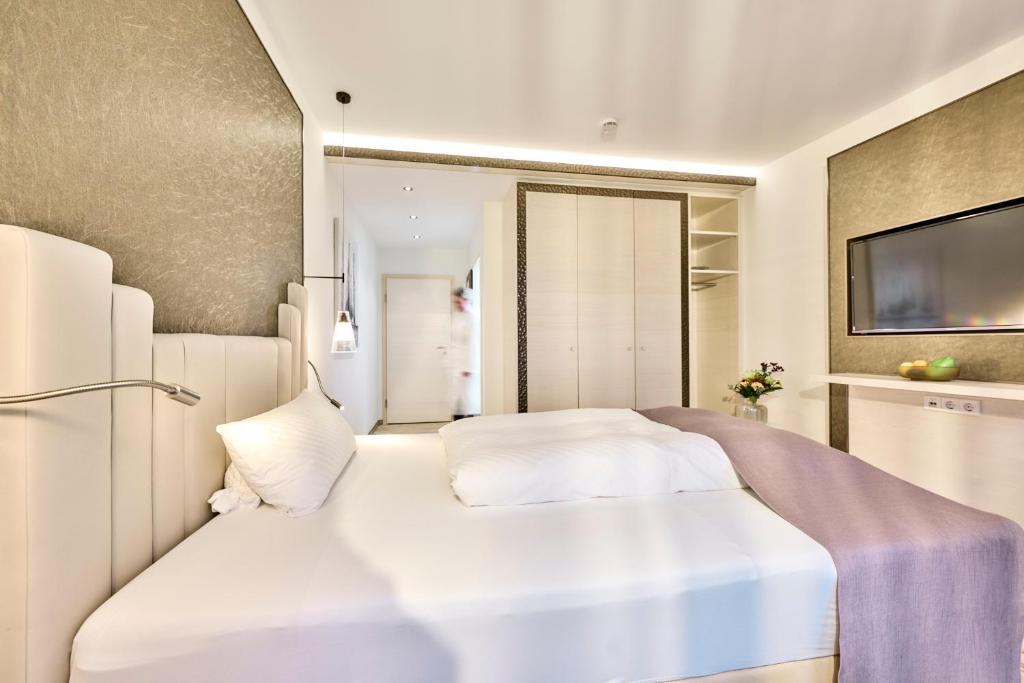 Postel nebo postele na pokoji v ubytování Janssens Hotel