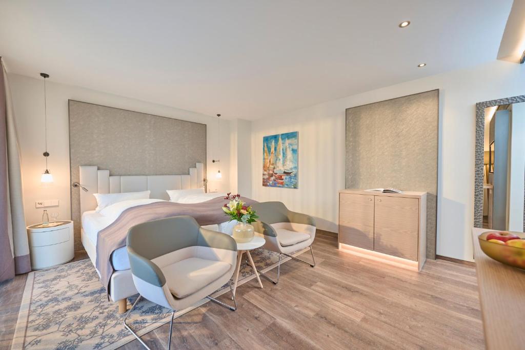 Postel nebo postele na pokoji v ubytování Janssens Hotel