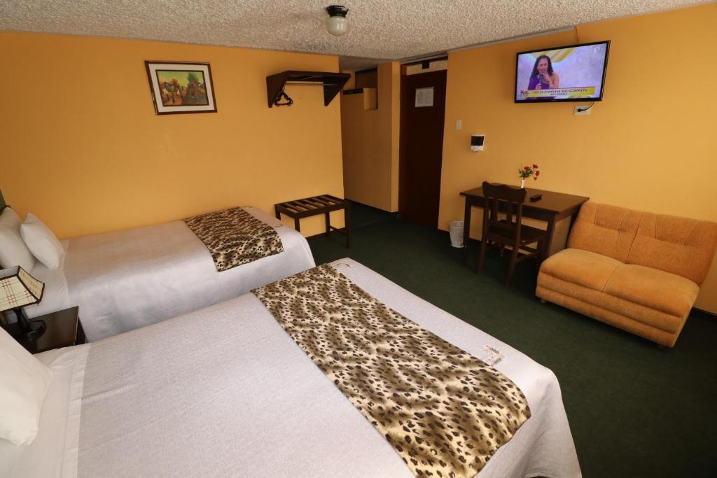 Postel nebo postele na pokoji v ubytování La Posada del Colca