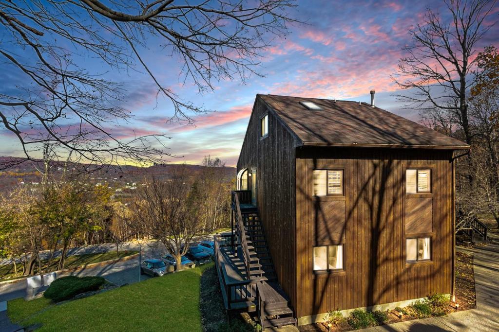 a barn house is shown with a sunset at Skylift Lodge - Luxury Mountain Creek family condo in Vernon Township