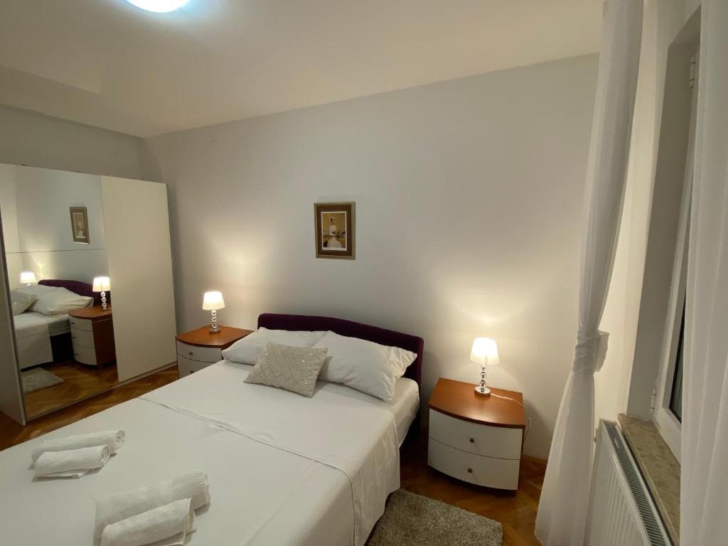 Postel nebo postele na pokoji v ubytování Apartment Tina