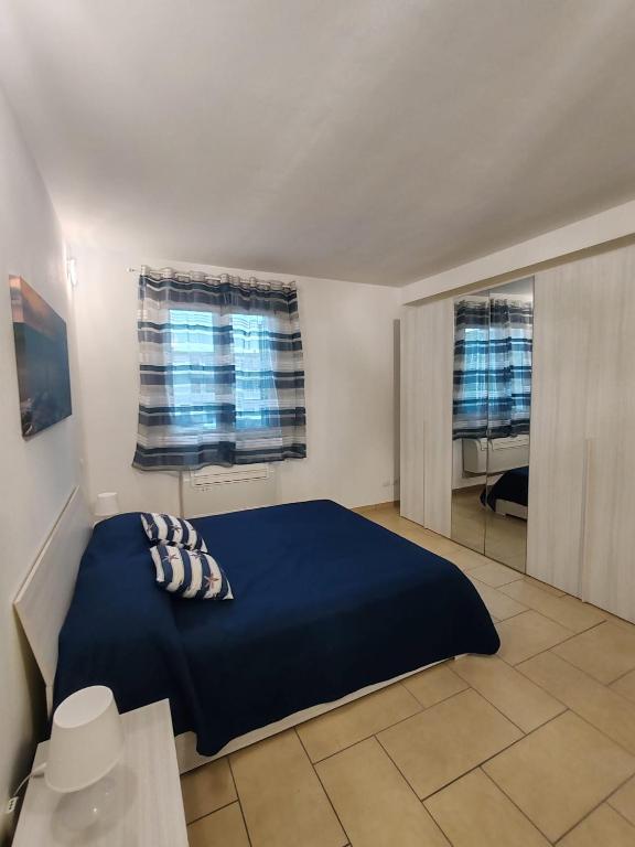 Ένα ή περισσότερα κρεβάτια σε δωμάτιο στο ONDINA APARTMENT IN VERSILIA