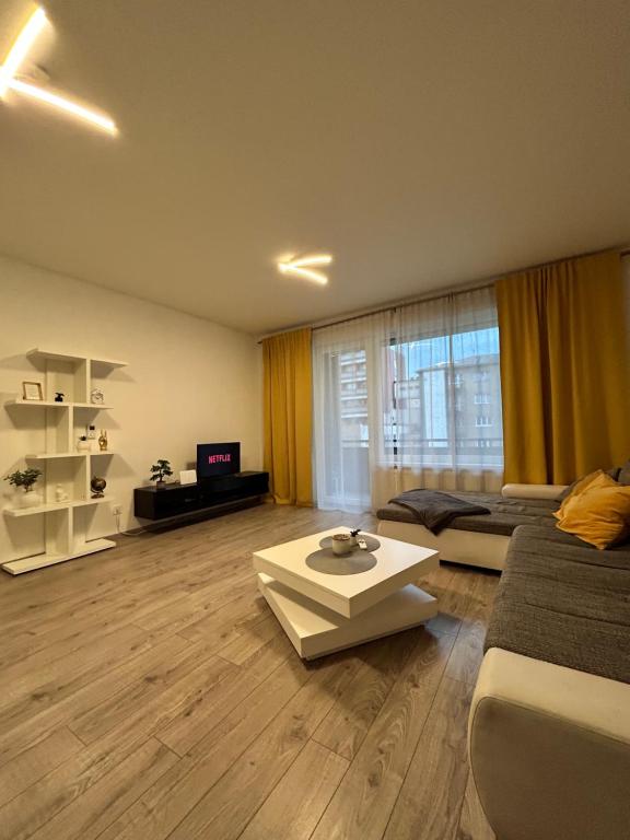 a living room with a couch and a table at AR RADNICA HOUSE in Košice