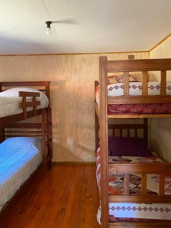 Postel nebo postele na pokoji v ubytování Cabañas Captren Andino