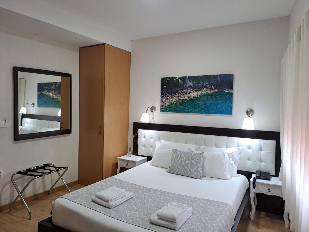 Ein Bett oder Betten in einem Zimmer der Unterkunft Hotel SQUARE