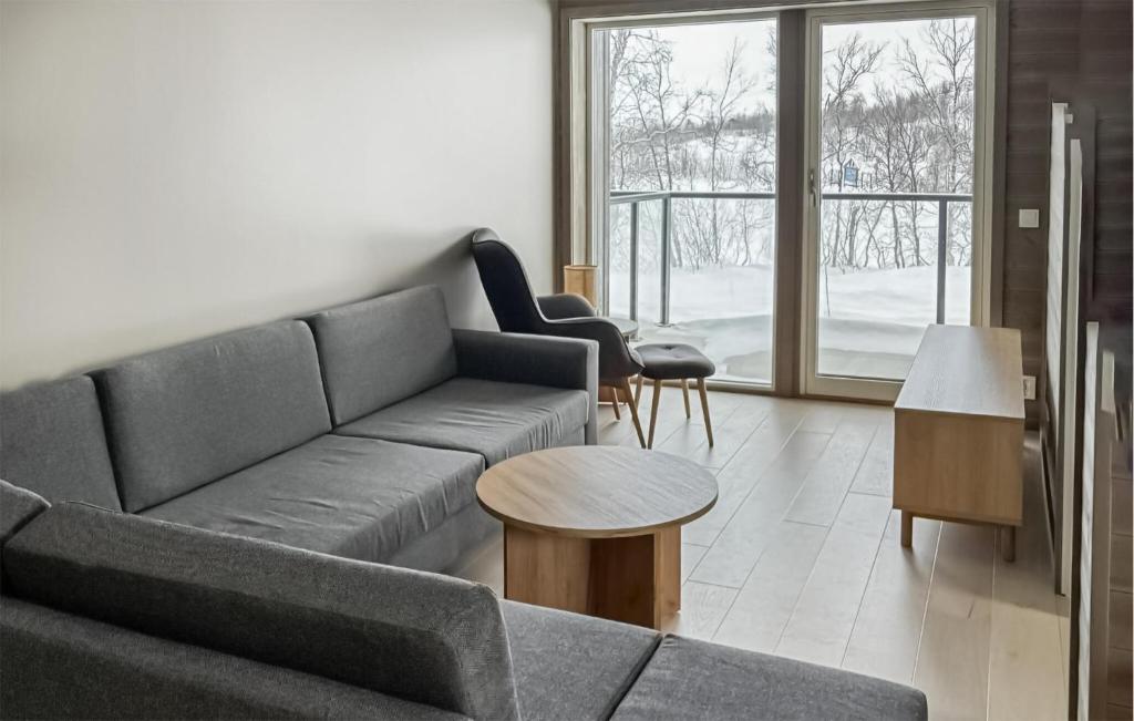 a living room with a couch and a table at 2 Bedroom Nice Apartment In Geilo in Geilo