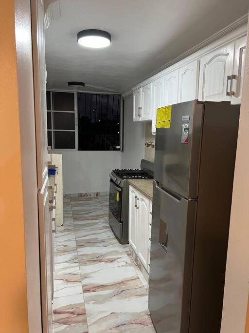 Kuchyň nebo kuchyňský kout v ubytování Moderno Apt en la ciudad