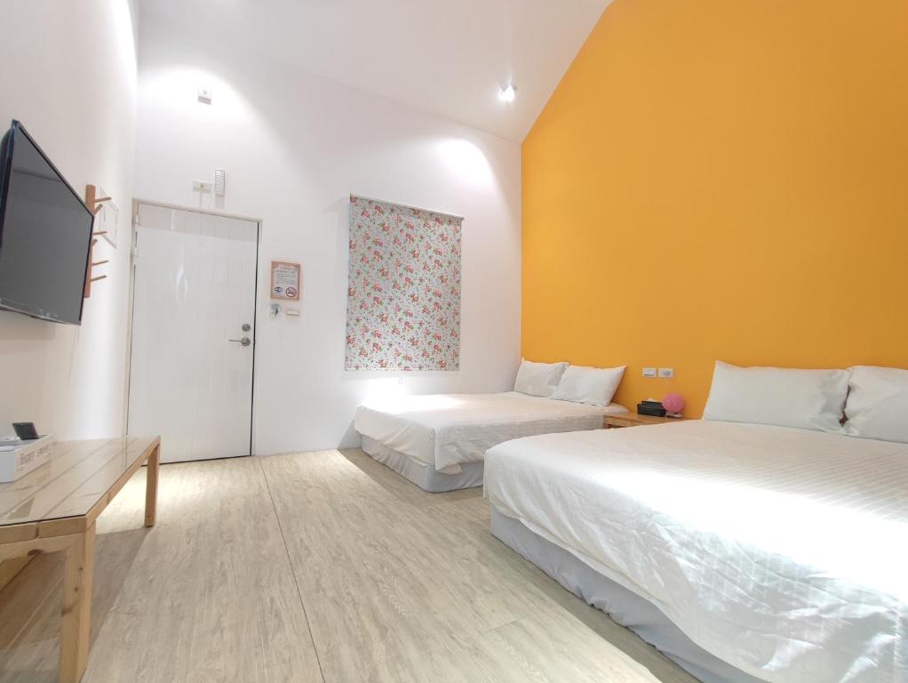 Cama ou camas em um quarto em Liuqiu Guihua Homestay