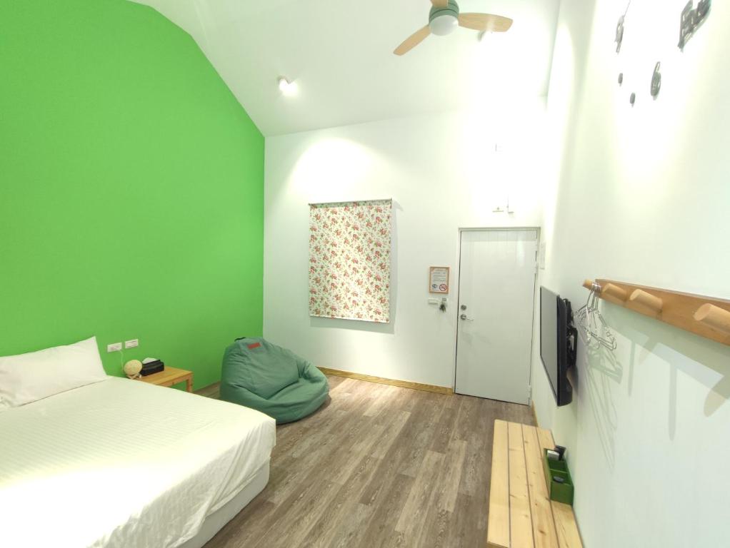 Cama ou camas em um quarto em Liuqiu Guihua Homestay