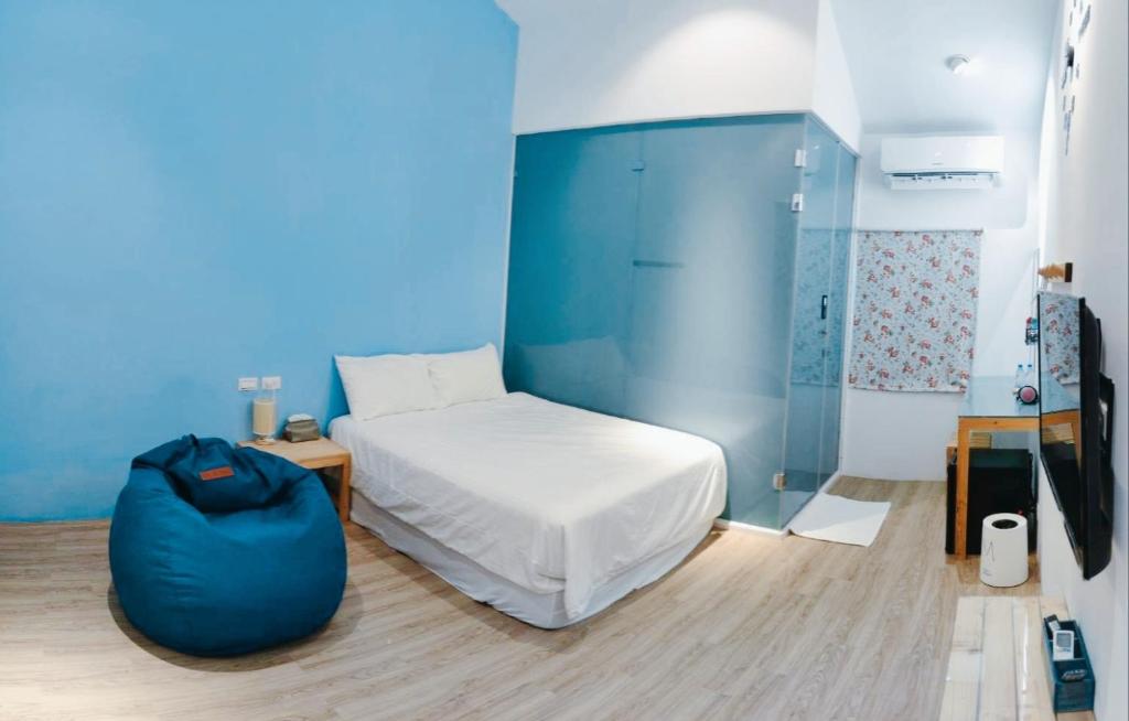 Cama ou camas em um quarto em Liuqiu Guihua Homestay
