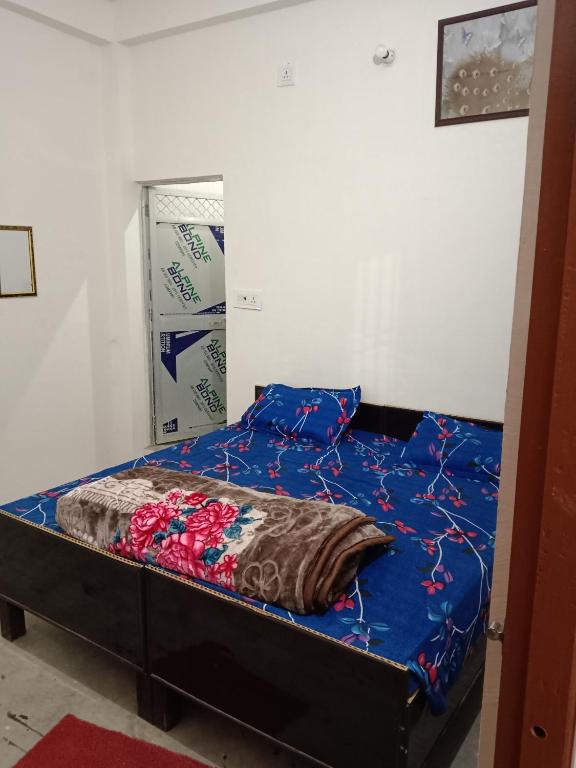 Postel nebo postele na pokoji v ubytování Ramrameti Homestay
