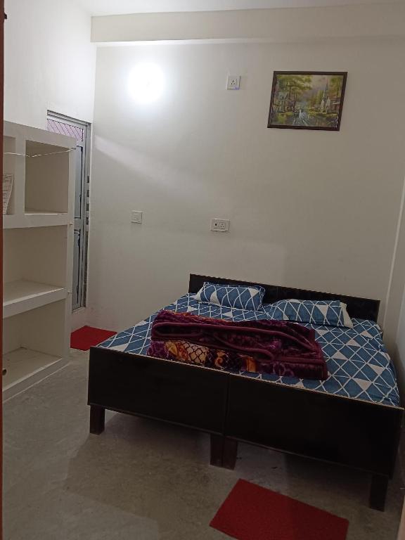 Postel nebo postele na pokoji v ubytování Ramrameti Homestay